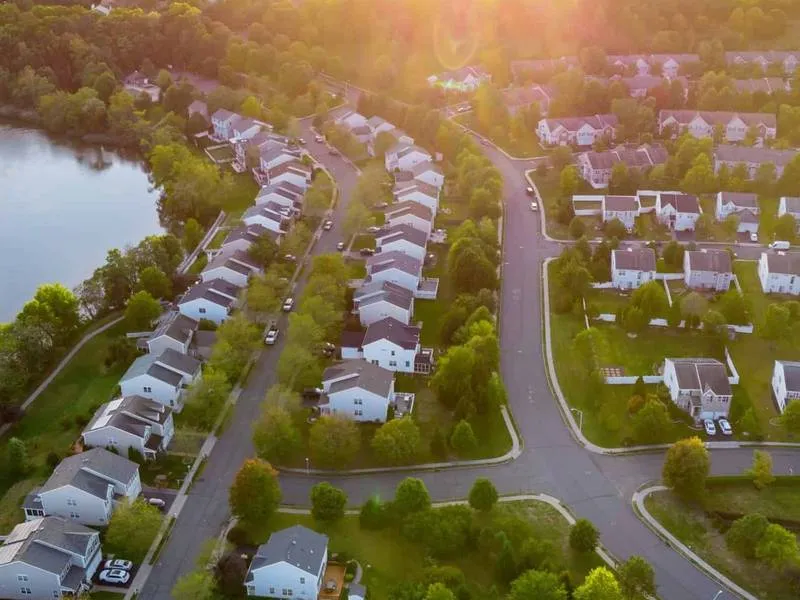 Aerial view of a residential neighborhood at sunset