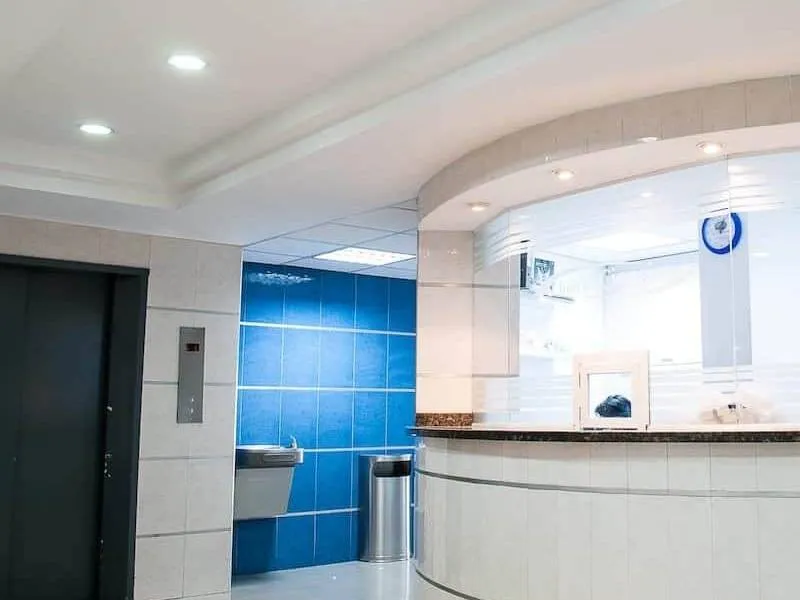 A reception desk in a bright commercial lobby